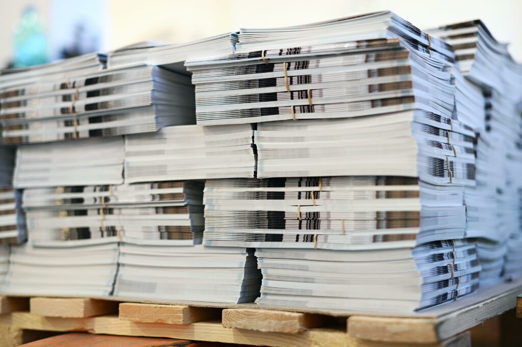 A picture of printed booklets on pallets.
